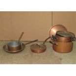 Three good quality heavy copper and tin lined two handled cooking pans and covers, a further
