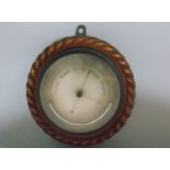 Rope twist aneroid barometer/thermometer, silvered engraved dial, 24cm diameter