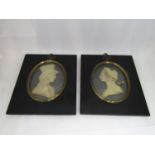 LESLIE RAY (Early 20th century British) , a pair of bust length miniature portraits of a lady and