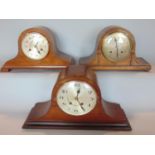 Three various Napoleon hat mantle clocks by Empire, Urgos of Germany and a further German example (