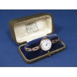 Early vintage gents 9ct dress watch, the enamelled dial with Arabic numerals and beaded gilt