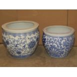 A modern Chinese ceramic blue and white jardiniere/fish bowl with foliate detail, 36 cm in diameter,