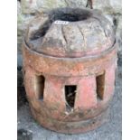 A 19th century wooden and steel banded cart hub with traces of original painted finish