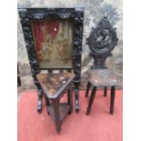 A Victorian carved oak fire screen with applied trailing floral rams mask, cherub and other