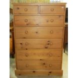 A Victorian style stripped pine bedroom chest of two short over five long drawers and moulded