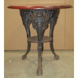 A Victorian style cast iron Britannia head pub table with circular mahogany top, 70cm diameter