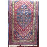 A good quality Persian full pile rug with central floral medallion and further floral bands upon a