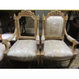 A pair of continental salon chairs, the carved and gilded frames with acanthus, repeating floral,