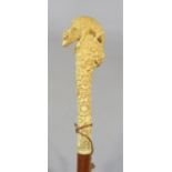 Carved Black Forest and Malacca swagger stick, mounted by a sheep and floral knop