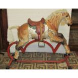 A vintage Triang child's light steel/tin rocking horse with tubular stand (AF)