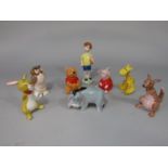A collection of eight Beswick Walt Disney figure from Winnie the Pooh series comprising