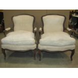 A pair of 19th century futiles, with cream ground floral patterned upholstered seats and shield
