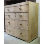 A 19th century stripped pine caddy top bedroom chest of two short over three long graduated