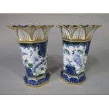 A pair of Royal Crown Derby vases of octagonal form with flared rims and blue and green exotic