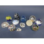 A collection of ten paperweights to include millefiori example together with two crystal glass
