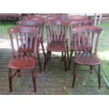 A Harlequin set of eight Windsor stained elm and beechwood lath back kitchen chairs, raised on