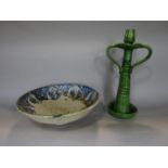 A large green glazed two handled candlestick in the arts and crafts style, 39cm tall approx,