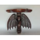 Carved oak wall bracket with serpentine top and bracket in the form of a grotesque bird, 33cm high