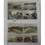 An album containing a large quantity of black and white topographical postcards together with a