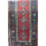 Good quality full pile runner with nine blue medallion upon a washed red ground, 280 x 170cm
