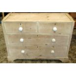 A Victorian stripped pine chest of two short over two long graduated drawers on short bracket