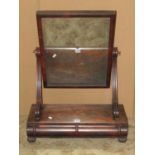 A late regency/William IV mahogany toilet mirror, with rectangular plate, scrolled supports and