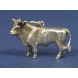 Cast silver pendant or charm in the form of a standing bull, 3.5cm long