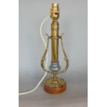 A weighted brass stick lamp, on a swivel platform, 32cm high