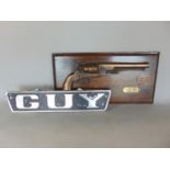 Cast aluminium vehicle badge inscribed GUY, and a further gun wall plaque for the Civil War Navy