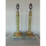 A large collection of various desk and table lamps to include treen and metal examples and other