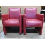 A pair of contemporary, but art deco in style, red and white stitched leather club armchairs