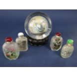 A collection of four Chinese reverse painted glass scent bottles, together with a further Chinese