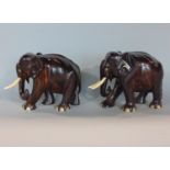 A pair of carved Madagascan hardwood and ivory elephants, 13cm high (2)