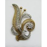 Stylised diamond spray brooch in unmarked bi-colour metal, largest stone 0.25cts approx, 5.1cm