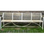 A 19th century heavy gauge strap work four seat garden/park bench with slightly curved back,