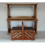 A vintage sewing box fitted with various accessories, together with two table top oak book
