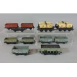 12 Hornby Dublo wagons including a grey hopper coal wagon marked21T. 6 open wagons, a coal wagon