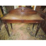 Mid-Victorian oak serving table of rectangular form, enclosing two frieze drawers, raised on four