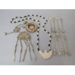 Oriental bijouterie lot to include a set of eight white metal apostle spoons, white metal