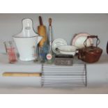 A mixed collection of antique kitchenalia to include various enamel wares, a copper kettle, three
