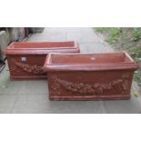 A pair of composition stone planters/flower troughs of rectangular form with moulded rims, raised