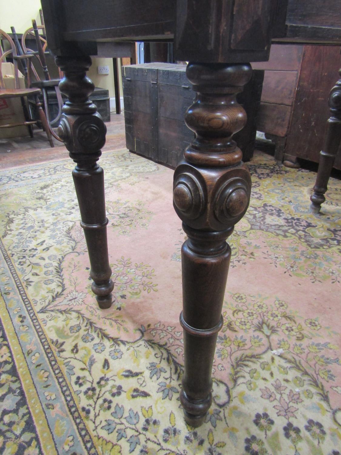 Mid-Victorian oak serving table of rectangular form, enclosing two frieze drawers, raised on four - Image 3 of 4