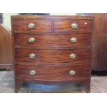 A regency mahogany bow fronted chest of three long and two short drawers with embossed brass plate