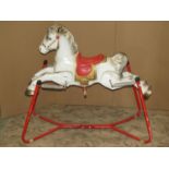 A vintage Mobo child's rocking horse with sprung painted tubular steel frame