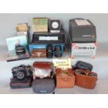 A collection of miscellaneous cameras including a Canon Ixus 1000 HS, a pair of Zeiss 8 x 30