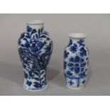 A small oriental blue and white vase of shouldered form with dragon and flowering plant