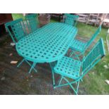 A contemporary green painted light steel D ended garden terrace table and five matching folding