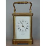 J W Benson carriage clock, the enamel dial with Roman and Arabic numerals, striking on a gong with