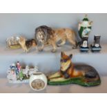 An assortment of interesting items to include a plaster study of a recumbent Alsatian, a porcelain