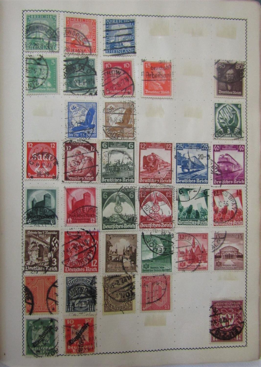 Three albums containing a collection of British and Worldwide stamps dating from the early 20th